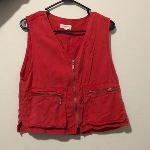 red staple vest